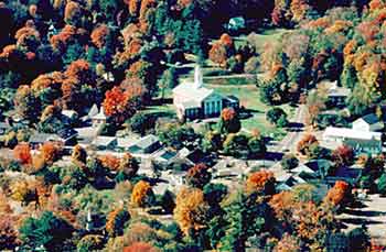 Aerial view of Bryan Memorial Town Hall with surrounding trees in Autumn color