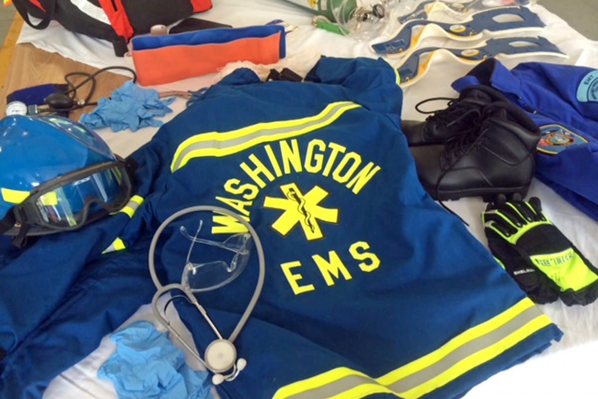 Close-up photo of Washington EMS uniform lying on table