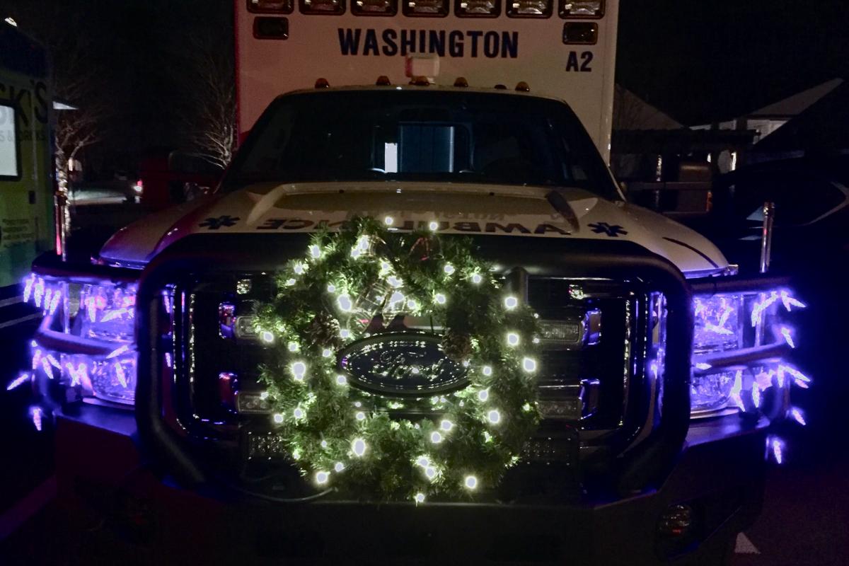 Holiday in the Depot 2016 - lighted wreath on vehicle in darkness